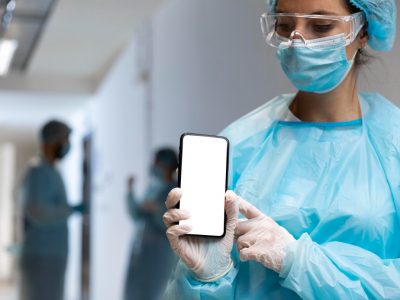 Healthcare provider using Medi-EHR Practice EHR Go Mobile App to review patient chart