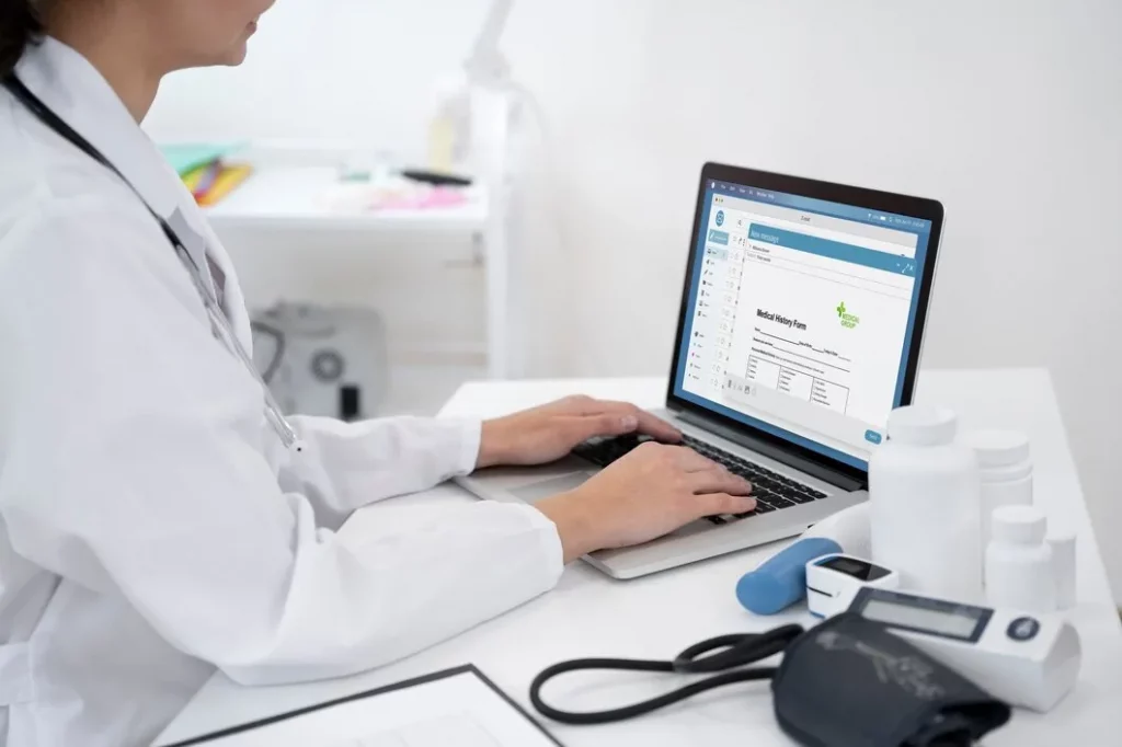 Healthcare provider comparing EHR systems online to choose the right software for their practice.