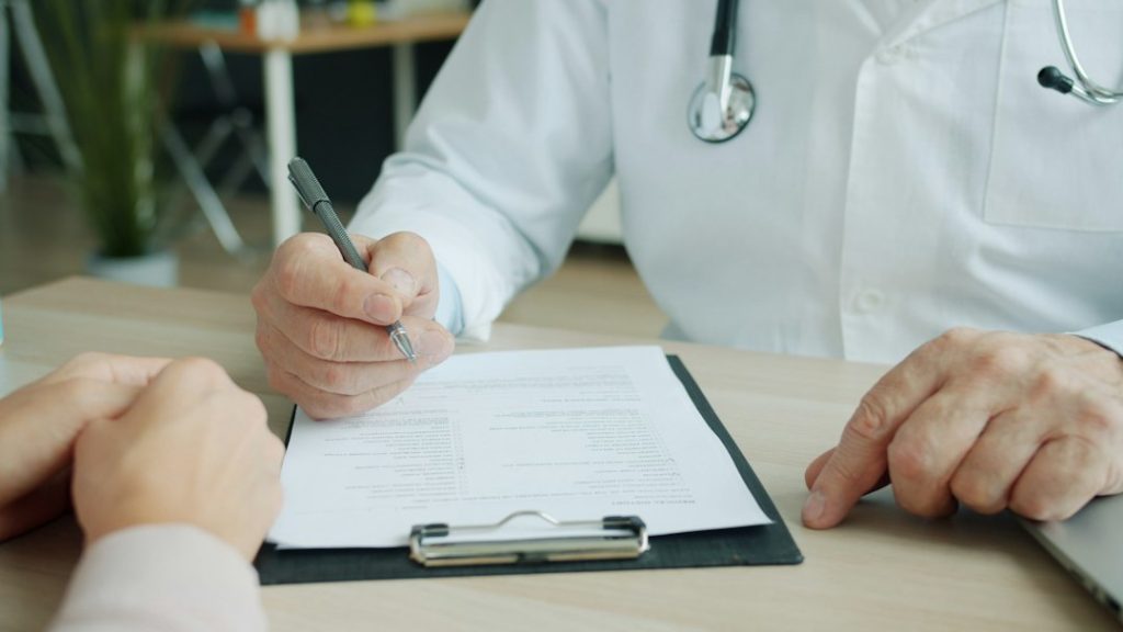 Healthcare provider documenting a patient visit for New York Workers' Compensation