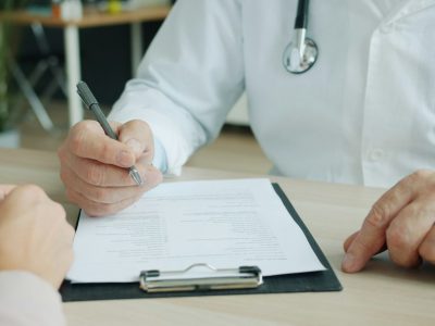 Healthcare provider documenting a patient visit for New York Workers' Compensation